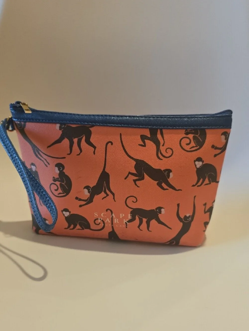 Scape Park Orange Wristlet Pouch with Navy Trim and Black Monkey Print